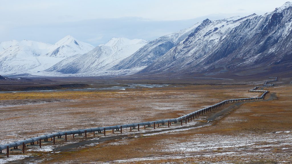 Oil pipeline in Alaska with mountain range