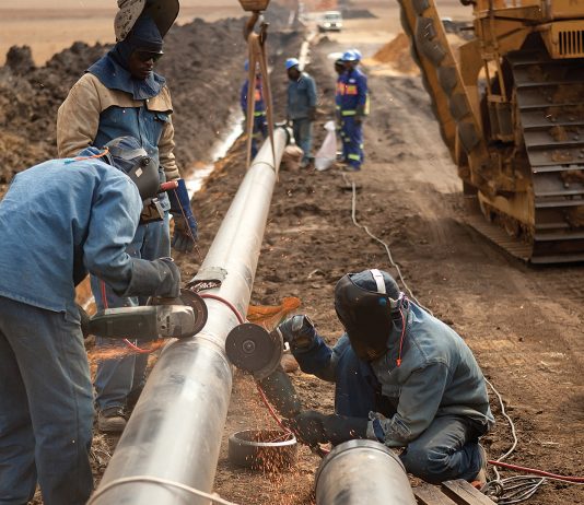 Laborers working on pipeline
