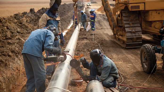 Laborers working on pipeline
