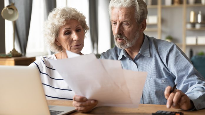 Senior citizens paying bills