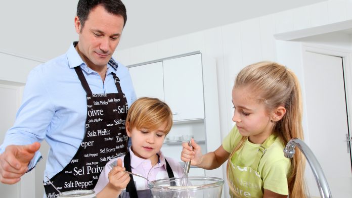 Dad cooking with children