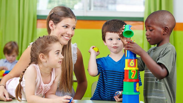 Kindergarten teacher with students