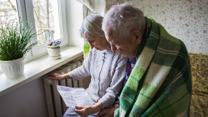 Senior couple looking at energy bill