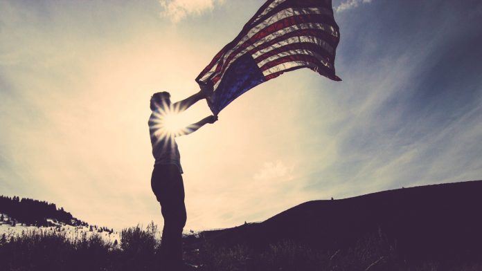 Man Flying American Flag