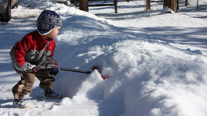 Child Shoveling Snow