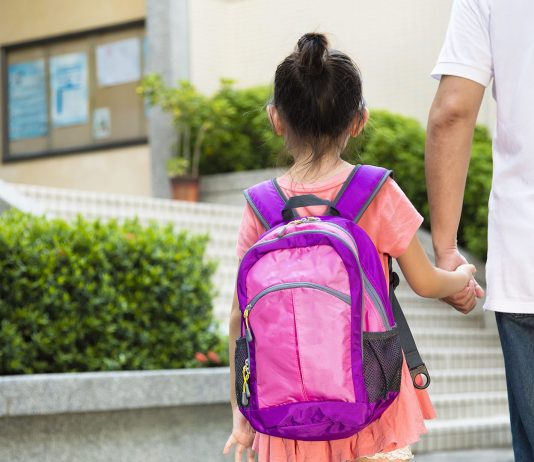 Father Walking To School With Daughter