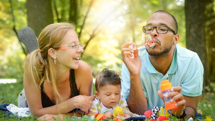 Family Outside Blowing Bubbles