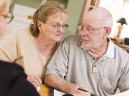 Senior Adult Couple Going Over Papers