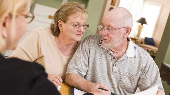 Senior Adult Couple Going Over Papers