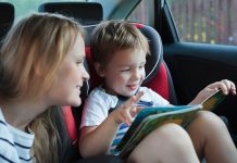 Mother and little son in the car reading