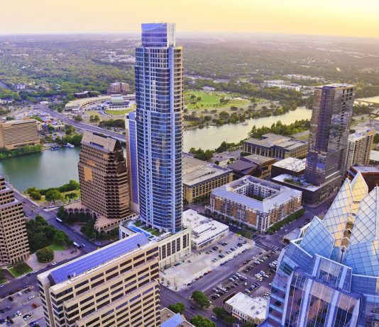 Austin Texas skyscrapers skyline aerial at sunset from helicopter