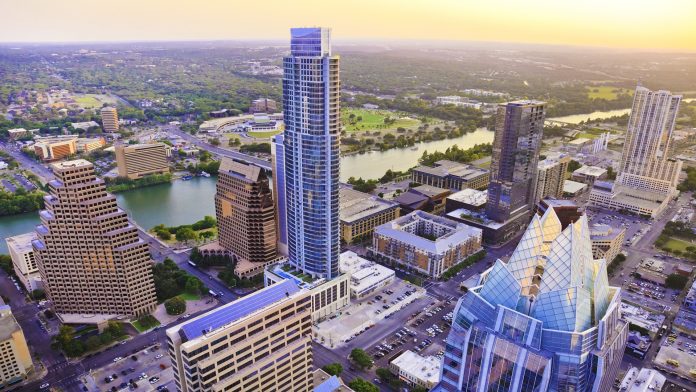 Austin Texas skyscrapers skyline aerial at sunset from helicopter