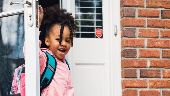 Child leaving house for school