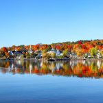 Autumn foliage reflection along the shores of Lake Winnipesaukee
