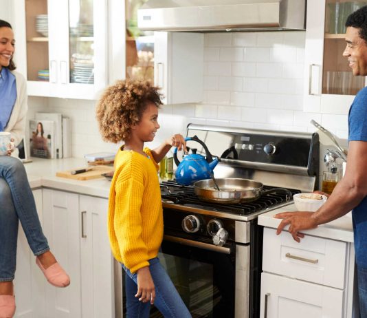Family Preparing Food on Natural Gas Stove