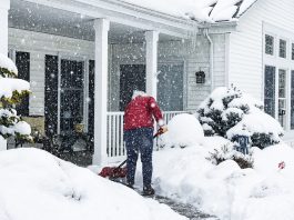 Woman Shoveling Snow