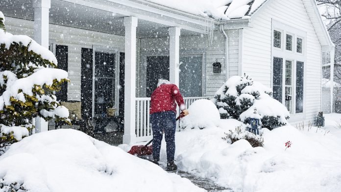 Woman Shoveling Snow