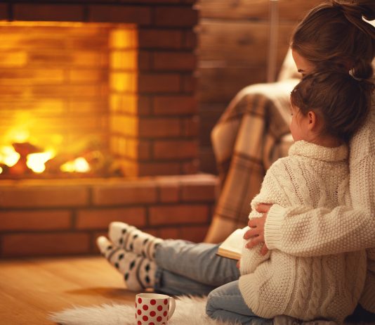 Mother and Child By Fireplace