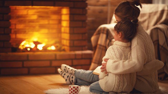 Mother and Child By Fireplace