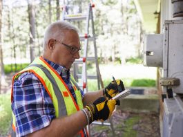 Man performing home energy audit