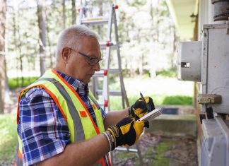 Man performing home energy audit