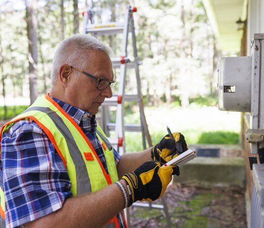 Man performing home energy audit