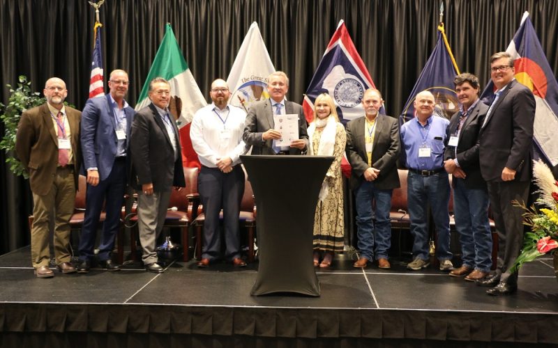 The Secretary of Economic Development for the State of Baja California, Mexico, Carlo Bonfante, center,holds the memorandum of understanding incorporating Baja California into the Western States and Tribal Nations initiative at the Uintah Basin Energy Summit in Vernal, UT.