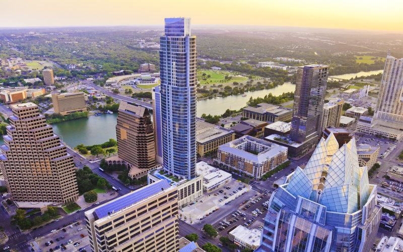 Austin Texas skyscrapers skyline aerial at sunset from helicopter