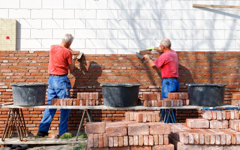 Bricklayers are building as a team