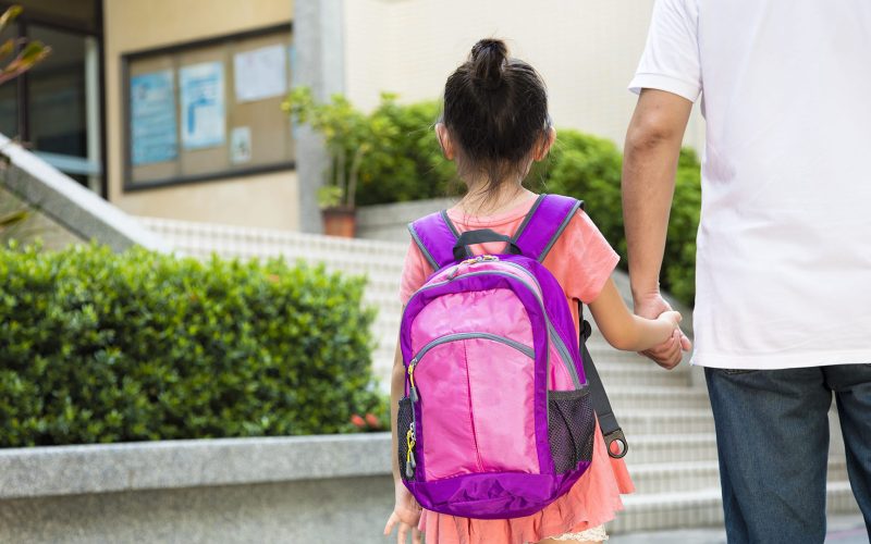 Father Walking To School With Daughter