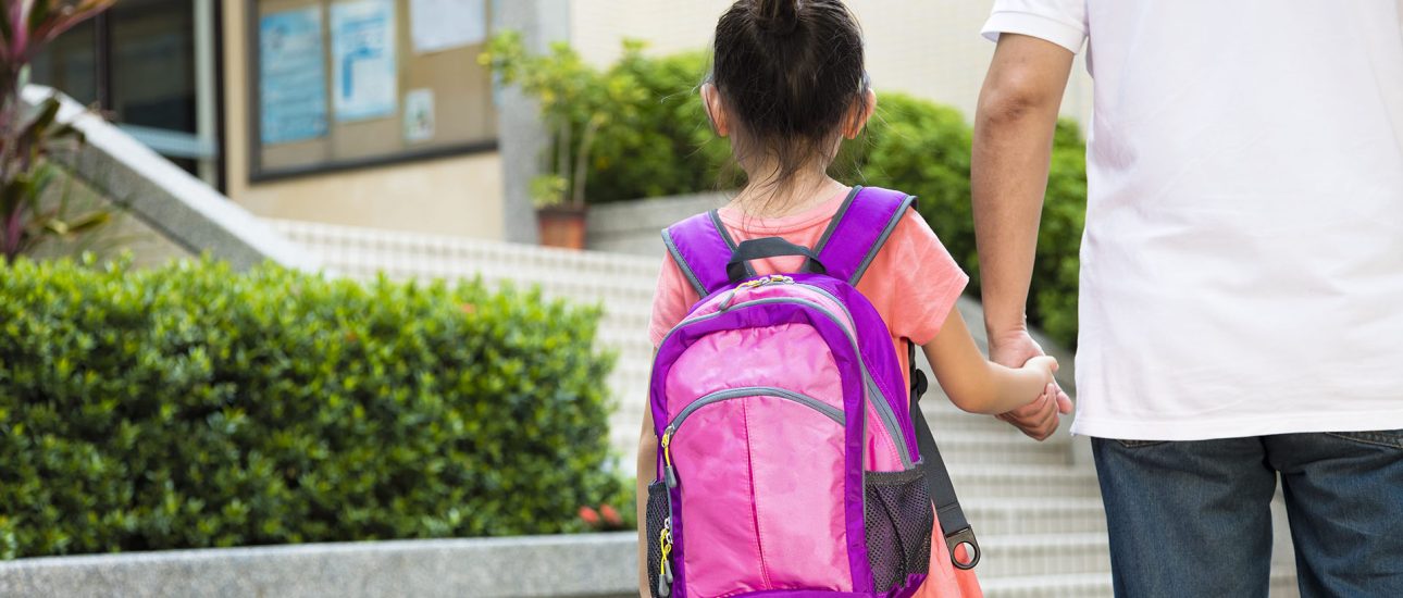 Father Walking To School With Daughter