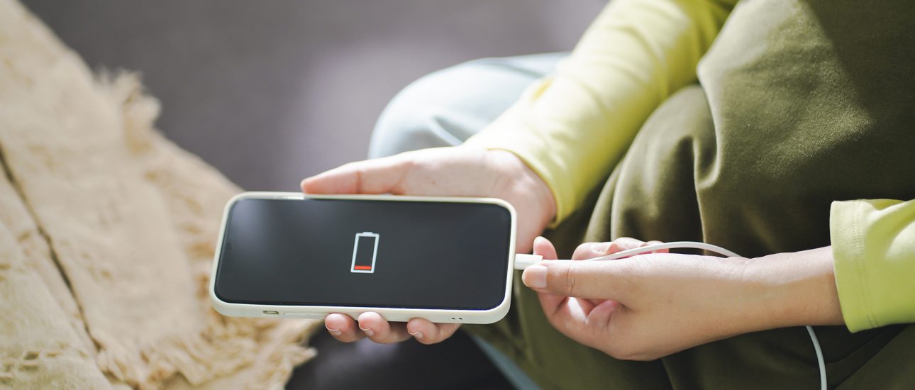 Woman charging cell phone