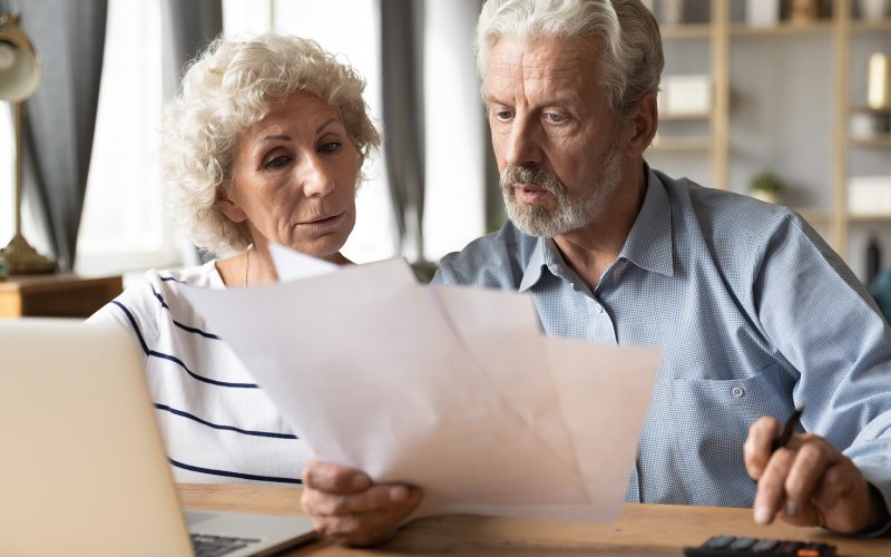 Senior citizens paying bills