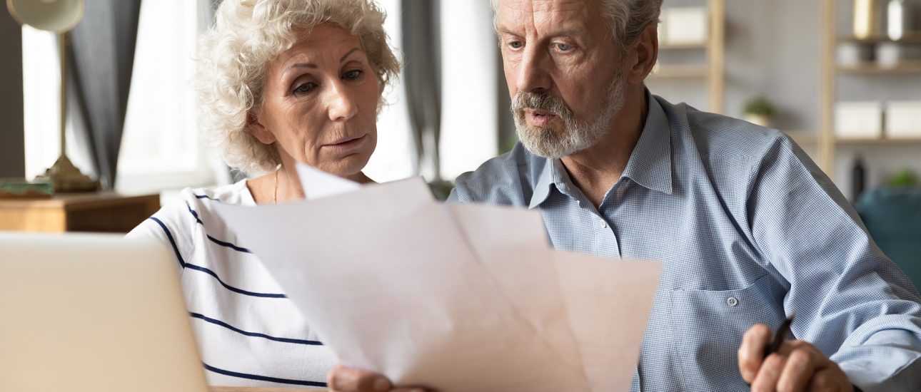 Senior citizens paying bills