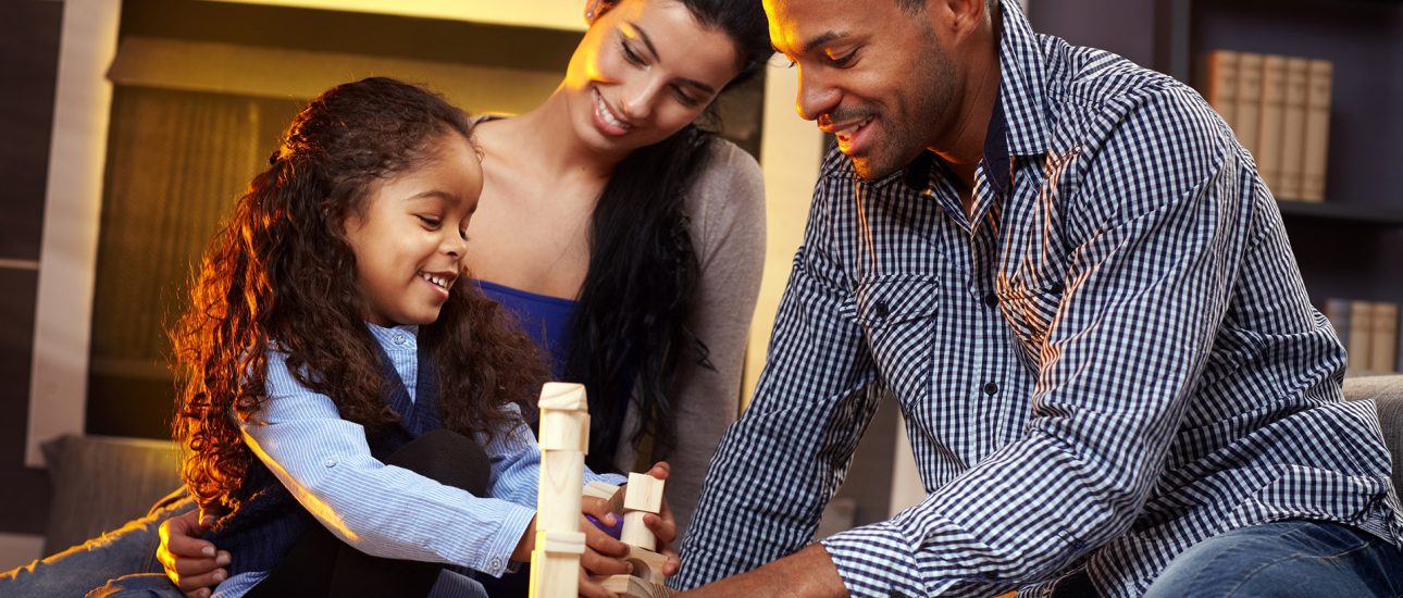 Parents and child building blocks