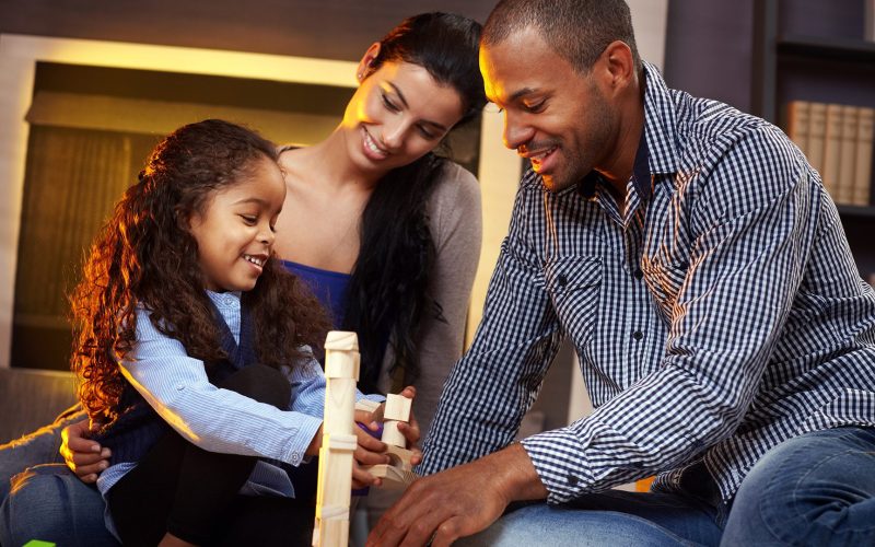 Parents and child building blocks