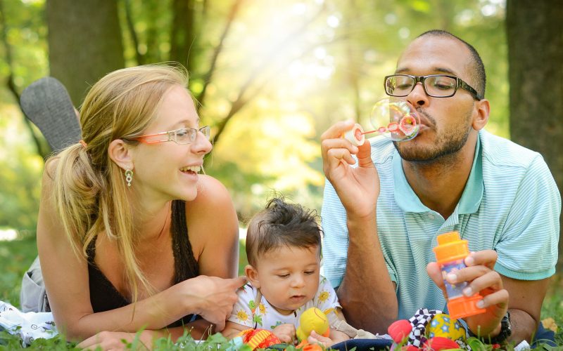 Family Outside Blowing Bubbles