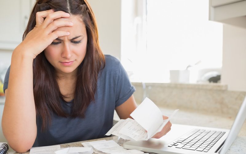 Woman looking at household bills