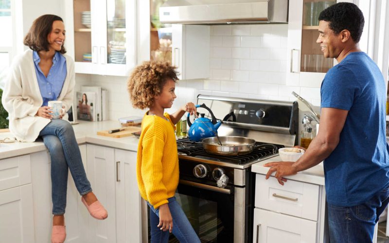 Family Preparing Food on Natural Gas Stove