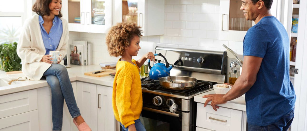 Family Preparing Food on Natural Gas Stove