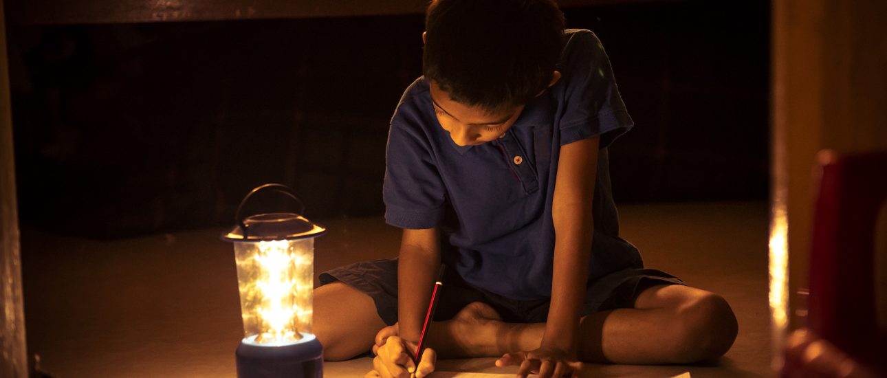 Child Doing Homework During Power Outage