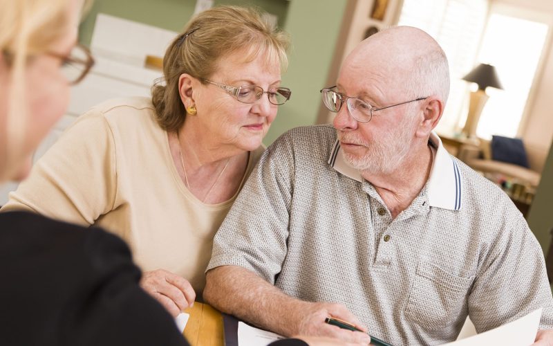 Senior Adult Couple Going Over Papers