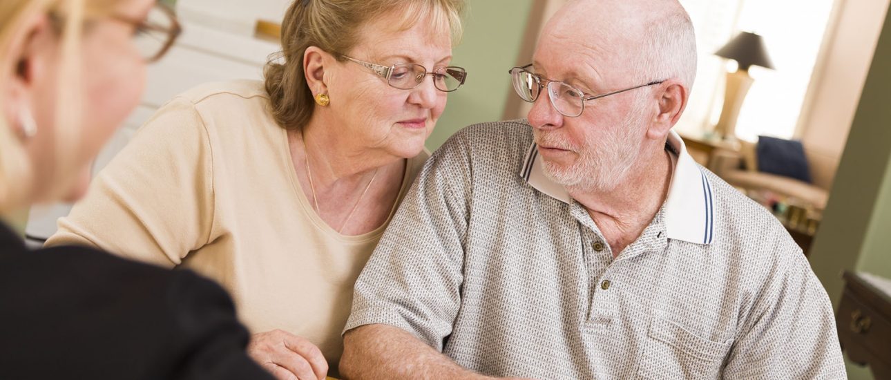 Senior Adult Couple Going Over Papers