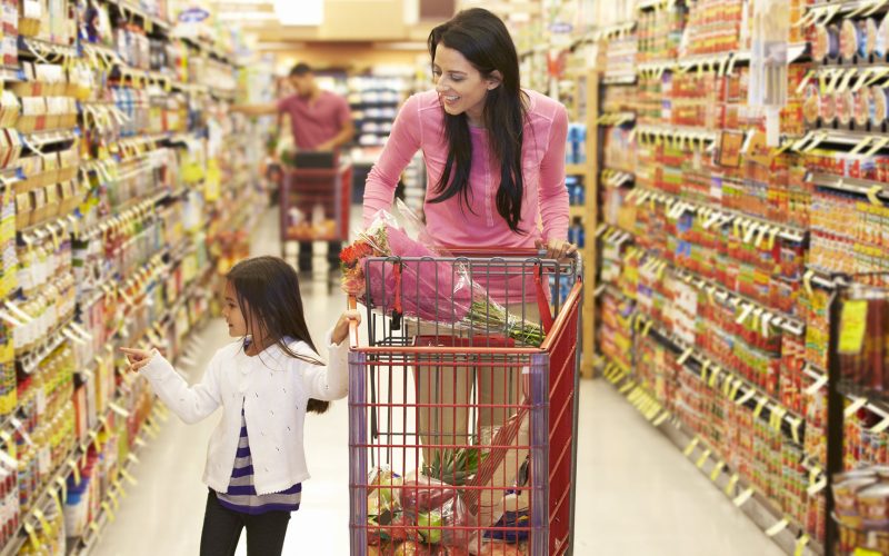 Mom and daughter grocery shopping