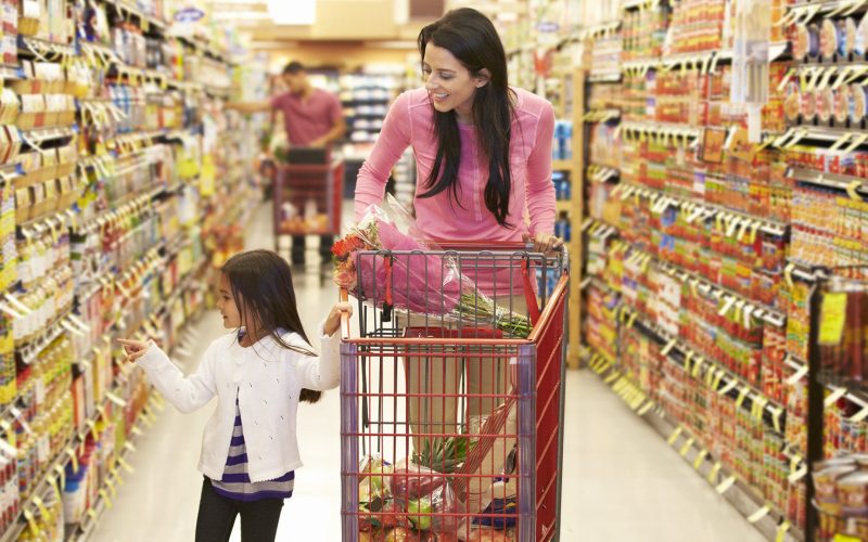 Mom and daughter grocery shopping