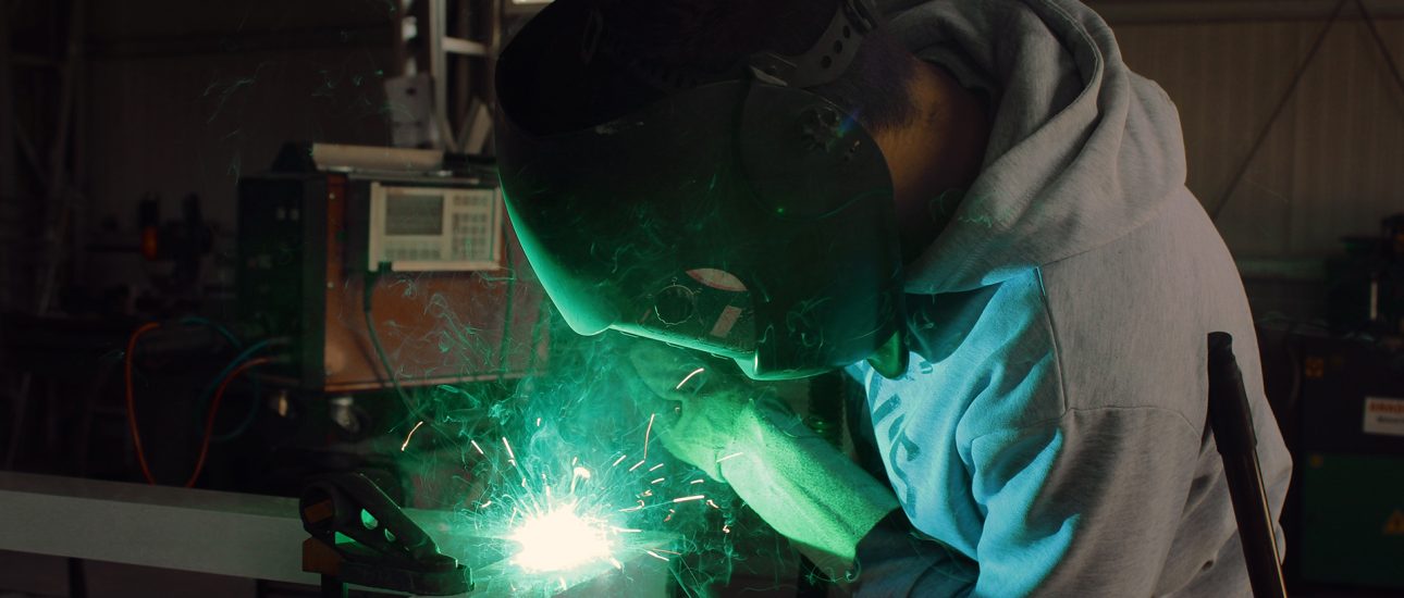 Welder in manufacturing facility