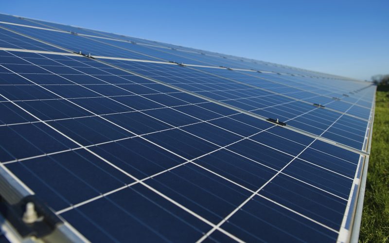 Row of solar panels on a solar farm