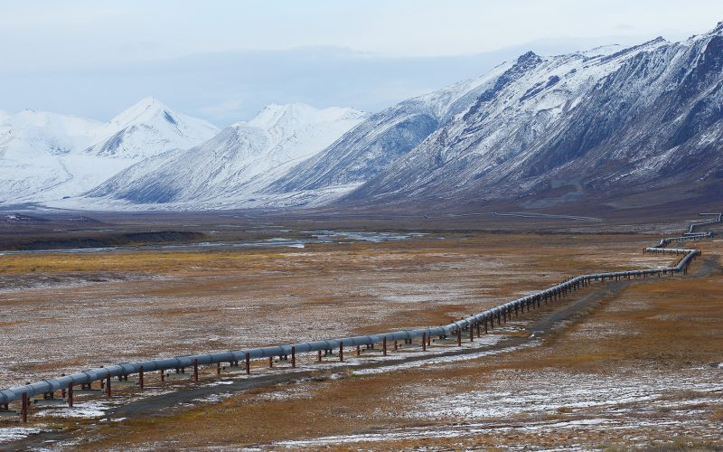 Oil pipeline in Alaska with mountain range