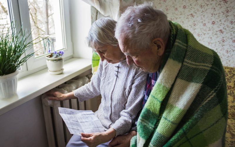 Senior couple looking at energy bill