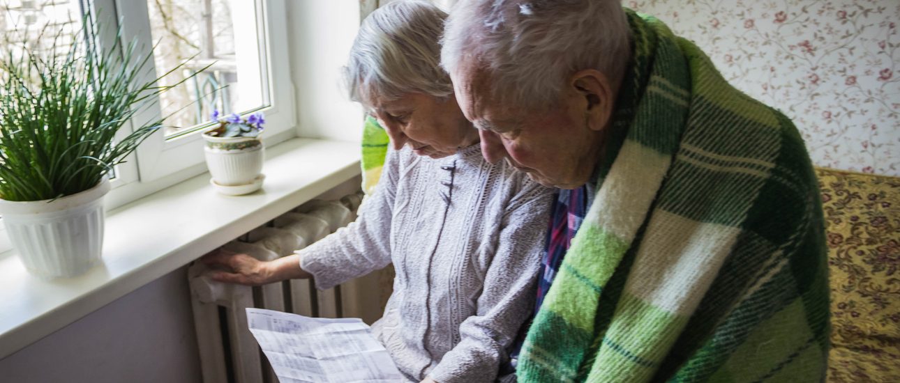 Senior couple looking at energy bill